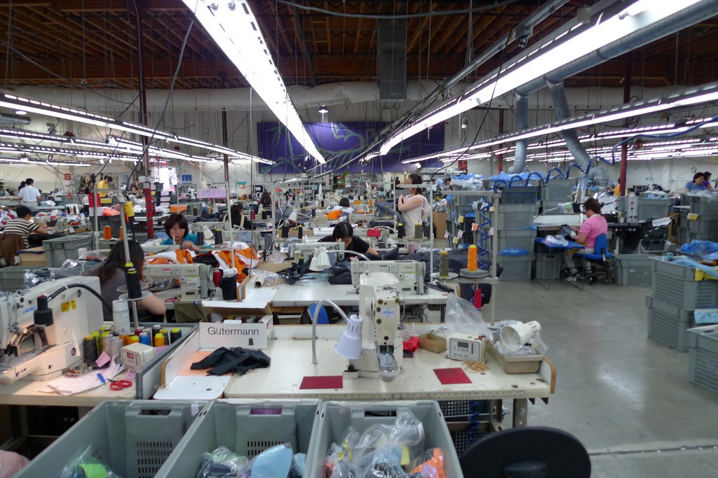 Factory sewing production floor for OEM waterproof outerwear quality-control review