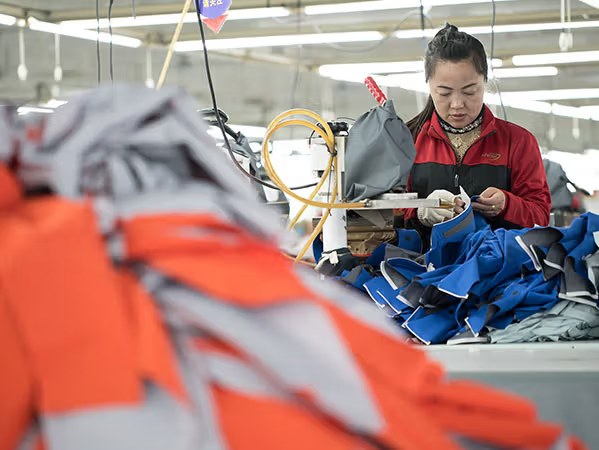 Factory worktable inspection for waterproof outerwear sample construction