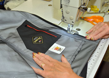 Sewing detail review for OEM waterproof outerwear sample construction